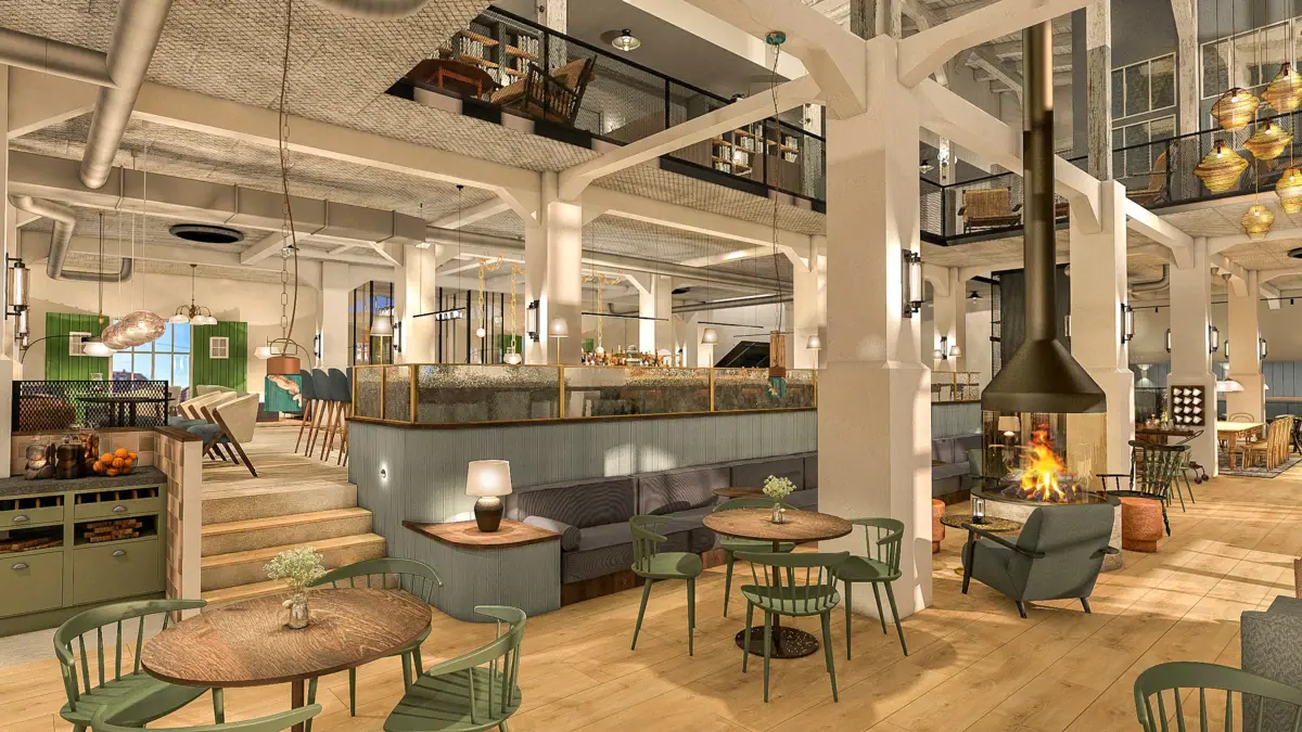 Ein Raum mit Tischen und Stühlen.