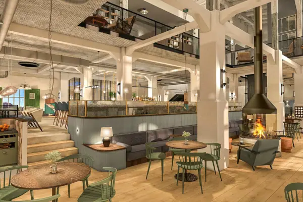 Ein Raum mit Tischen und Stühlen.