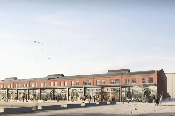 Ein Gebäude mit Menschen im Vordergrund.